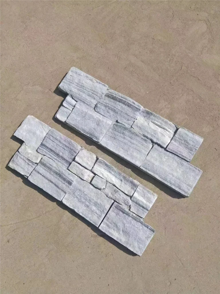 Grey slate ledger panel loose split‑face stacked stone pieces