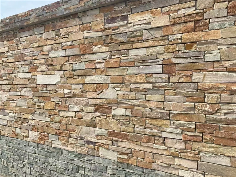 Rust colored natural stone ledger panels mixed tone exterior garden wall cladding