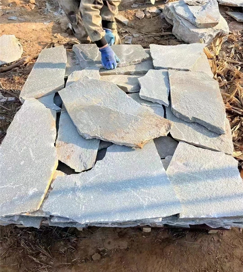 Grey Random Flagstone for Patios workers sorting natural stone pieces