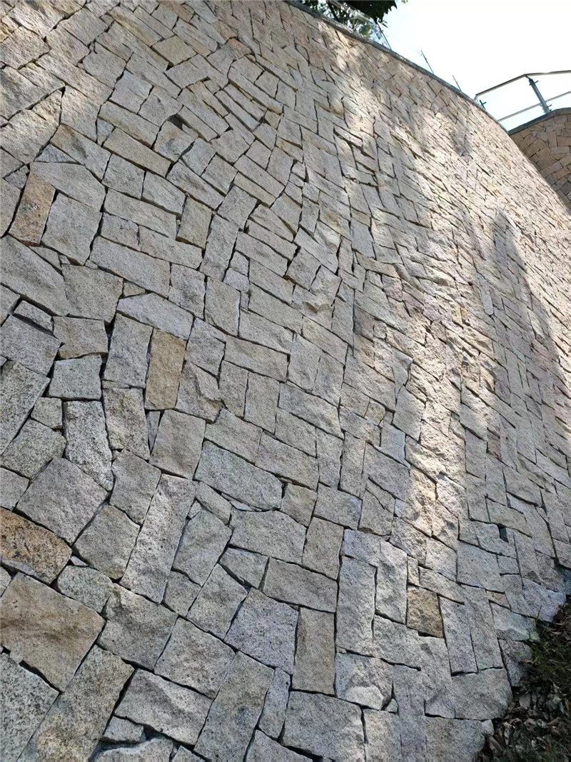 Light Yellow Random Rubble Stone, large curved landscape wall built with natural rubble stone