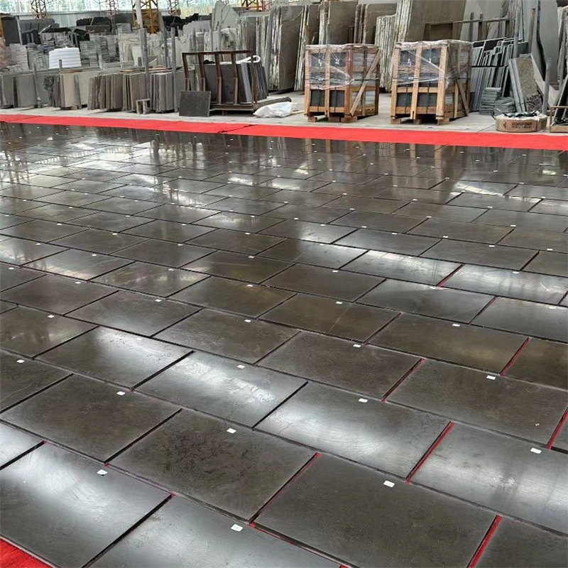 Black limestone with gold veins natural stone, stacked stone pieces and material selection