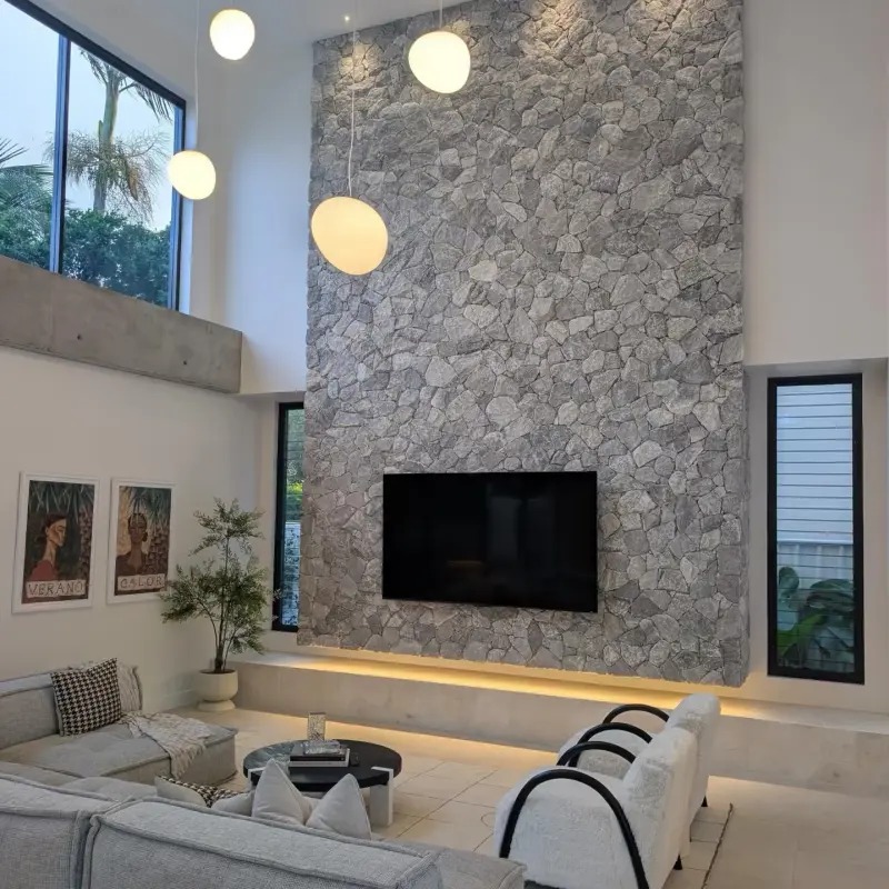 Grey irregular natural stone living room TV feature wall