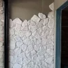 White random stone wall cladding, white crazy‑paving stone installed on interior accent wall