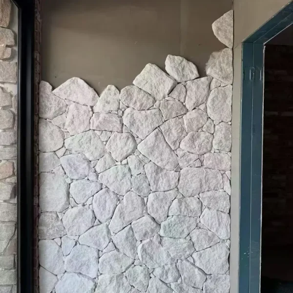 White random stone wall cladding, white crazy‑paving stone installed on interior accent wall