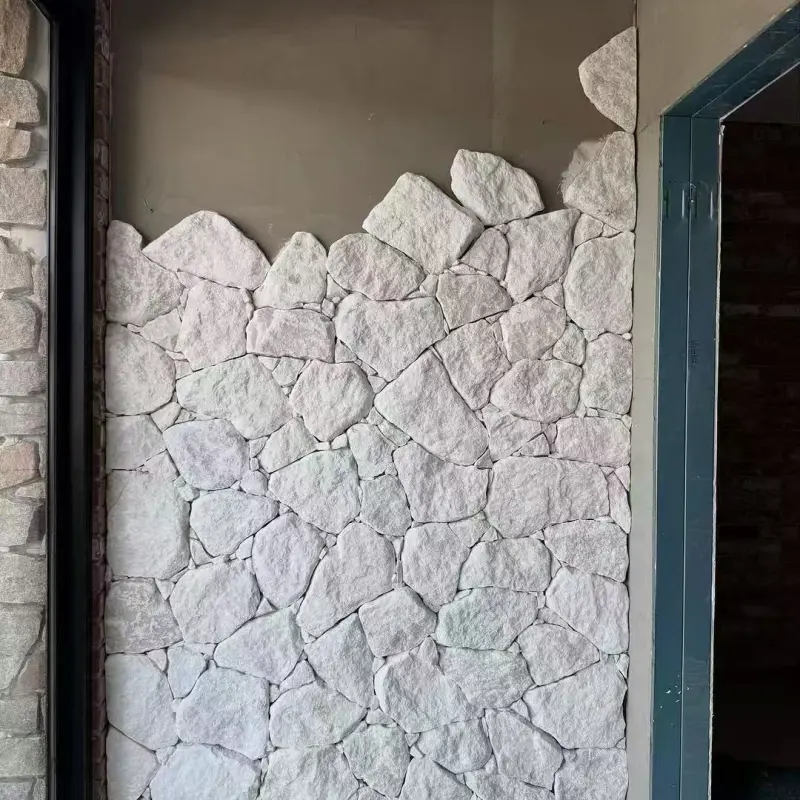 White natural crazy paving wall stone installed on interior feature wall