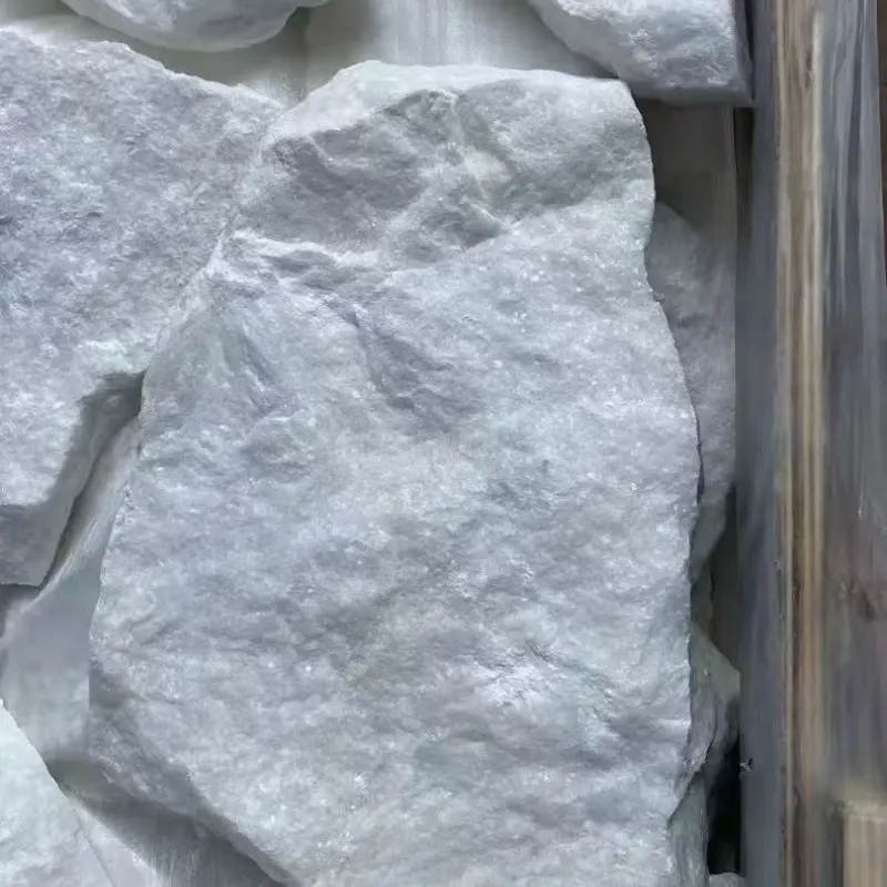 Close‑up view of white natural crazy paving wall stone rough split limestone surface